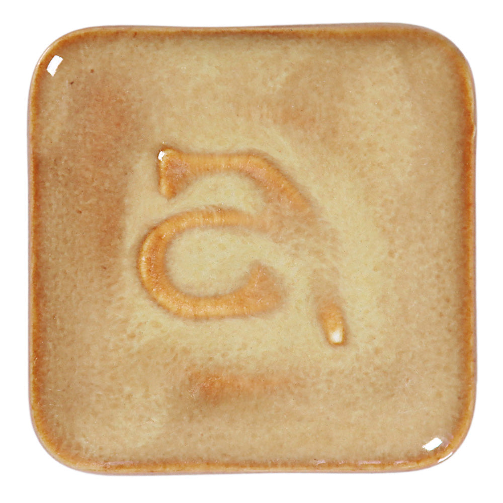Abbots Butterscotch glaze swatch showing reactive glossy surface with smooth and layered character.